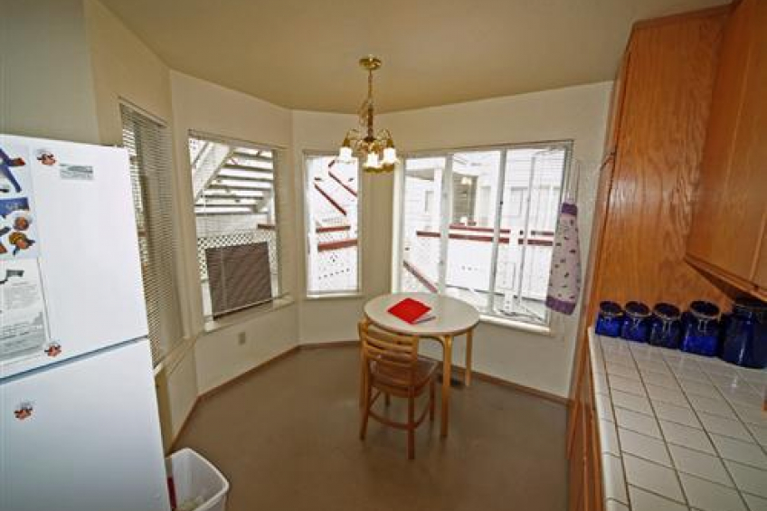 Large kitchen with eat-in area. There is a counter behind this position that opens to the living area. Resource #211807: image #3
