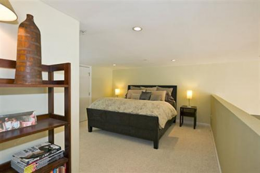 Mezzanine level includes one bedroom and a full bathroom. This is a California King-sized bed. Resource #232458: image #13