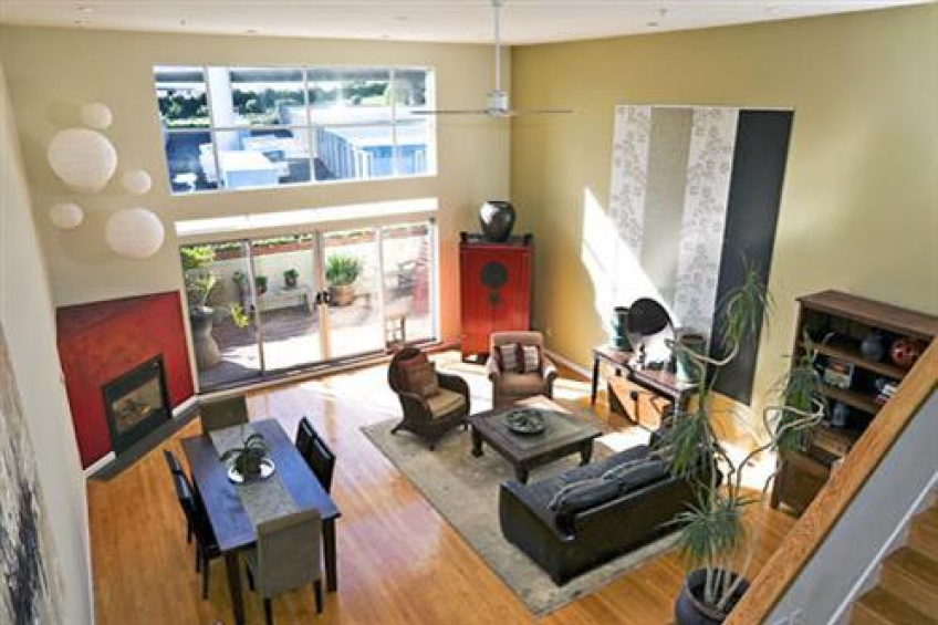 Dramatic windows and glass sliding doors allow sun to fill the space year-round. Resource #232458: image #7