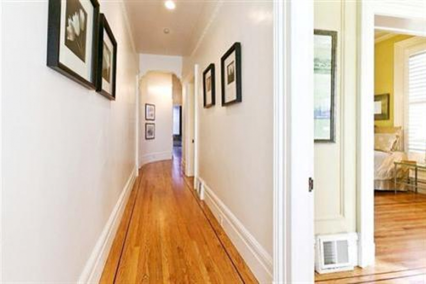 Curved hallway leads to Formal Dining Room and back bedroom. Resource #256667: image #13