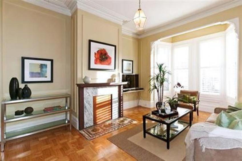 The original oak floors glisten and the sun pours in from the elegant bay window. 11' ceilings, crown moldings, decorative fireplace. This is fine architecture, with large, gracious, and functional rooms! Resource #256667: image #2