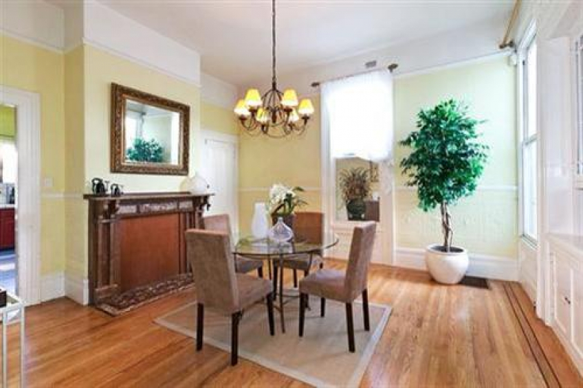 Formal Dining Room with decorative fireplace and lovely built in china cabinet is adjacent to kitchen. Door at back is for the interior stairway down to the lower level. Resource #256667: image #7