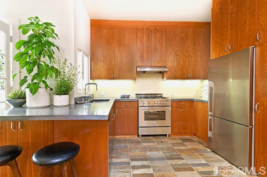 The kitchen boasts slate floors, a Bertazzoni gas range, Fisher & Paykel refrigerator, slate floors and beautiful FSC certified custom Cherry cabinetry. Resource #270649: image #5