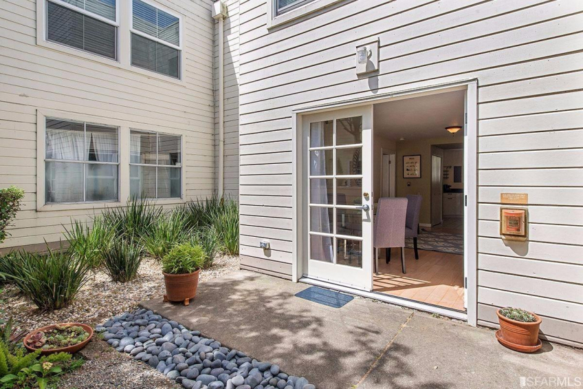 Exclusive use patio off the living area is sunny and makes this feel like a garden apartment. Resource #315375: image #2