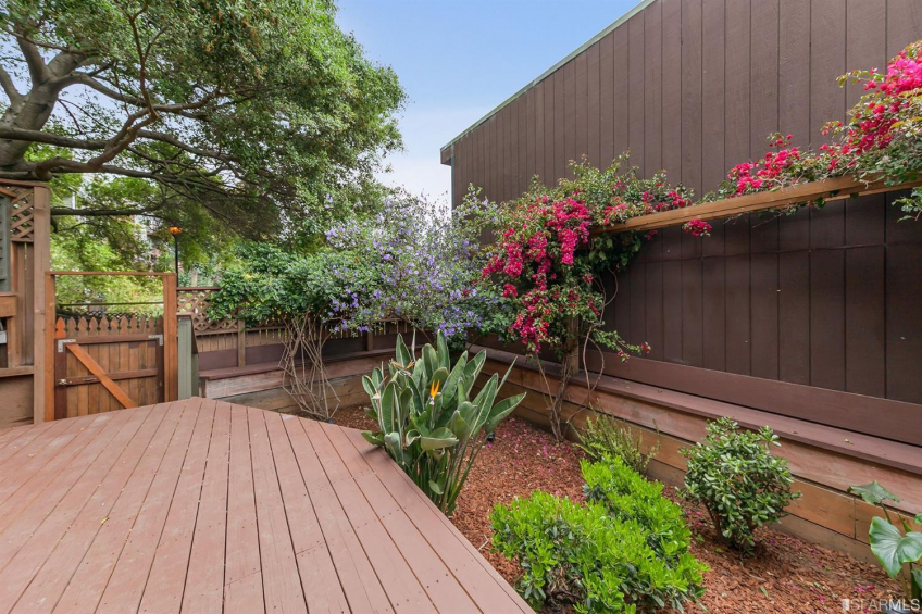 Backyard deck and garden. Note the gate which offers private access to the downstairs. Resource #337080: image #39
