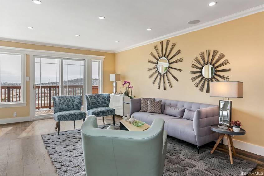 Living room opens to a gorgeous redwood deck overlooking the rear garden, San Francisco Bay, and East Bay. Resource #337080: image #9