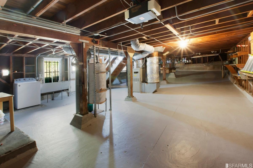 Cavernous, un-developed garage on the ground floor. Resource #349379: image #17