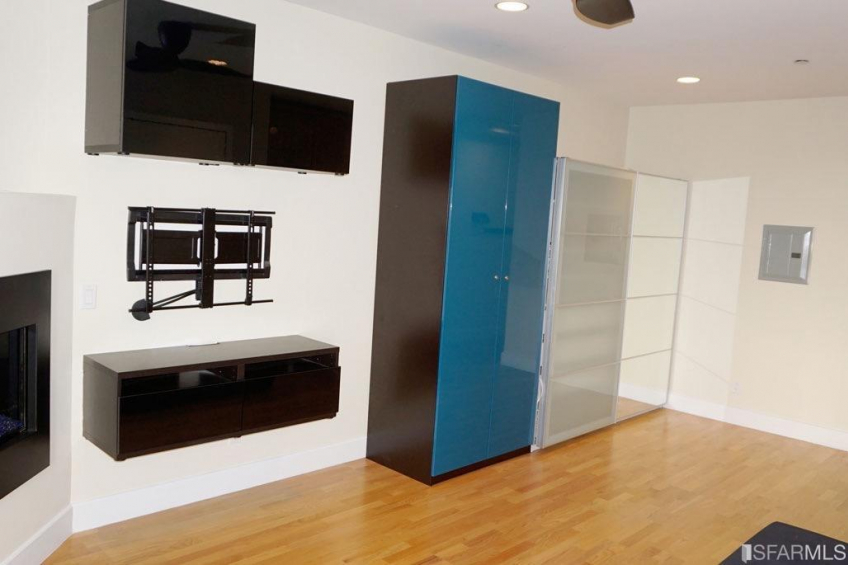 You have storage, a mount for your TV, and an attractive gas, in-wall heating unit. Resource #374464: image #6