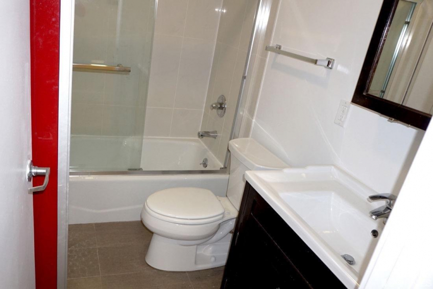 The shower is very nicely tiled and has a sliding glass shower door. Resource #374464: image #9